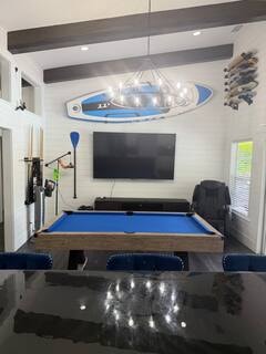 Game room entertainment wall with mounted TV