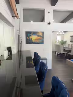 Coastal wave artwork in game room lounge area