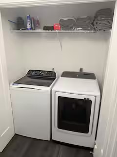 Master bathroom with dual sinks and LED mirror