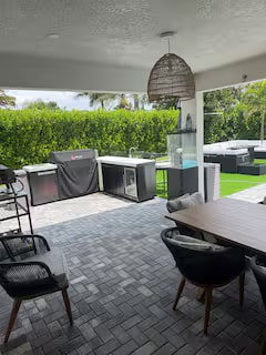 Covered outdoor kitchen with built-in grill