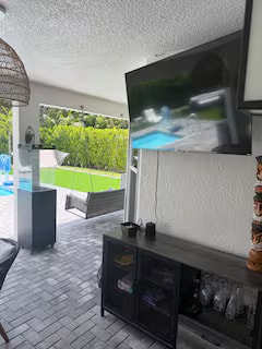 Outdoor TV and bar area by the pool