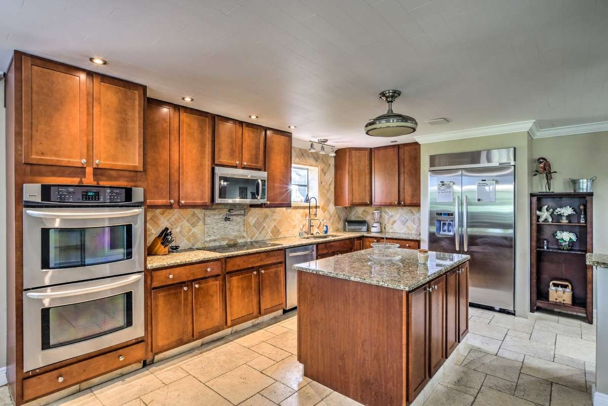 Kitchen with double wall ovens and full refrigerator