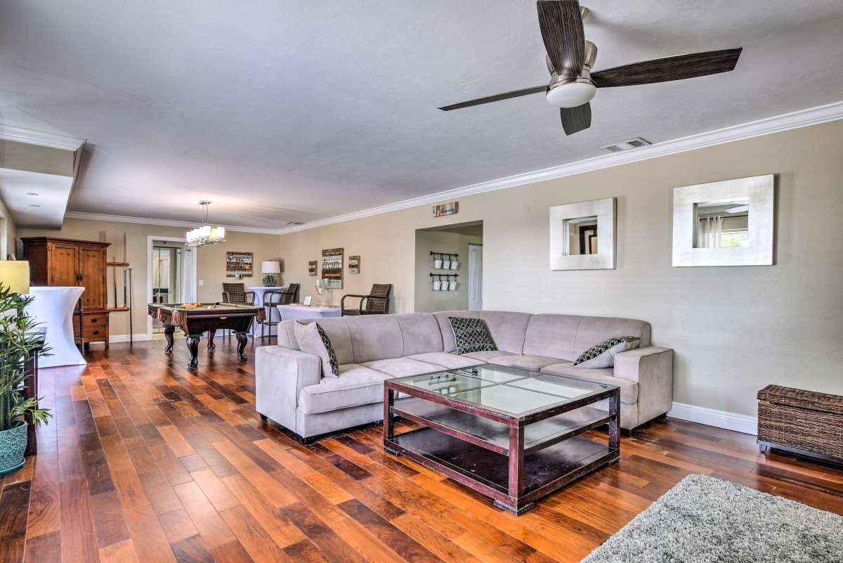 Open living room with pool table in background