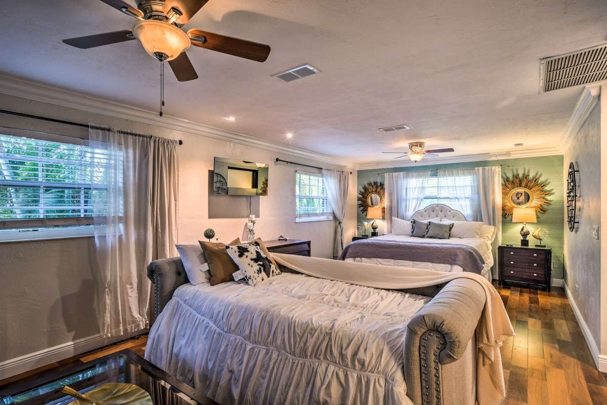 Second bedroom with queen beds and teal accent wall