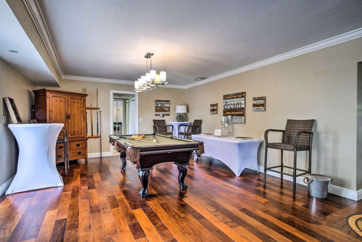 Pool table room with hardwood floors