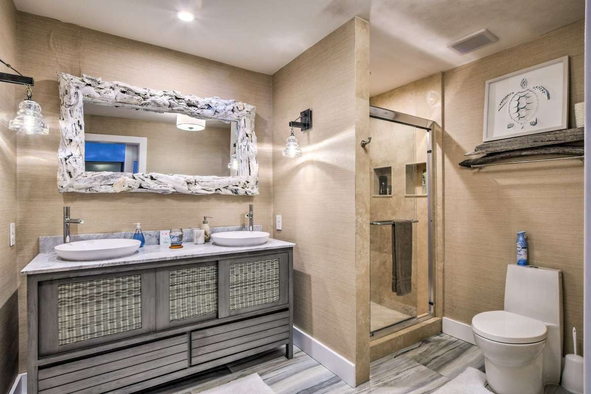 Upstairs bathroom with driftwood mirror and vessel sinks