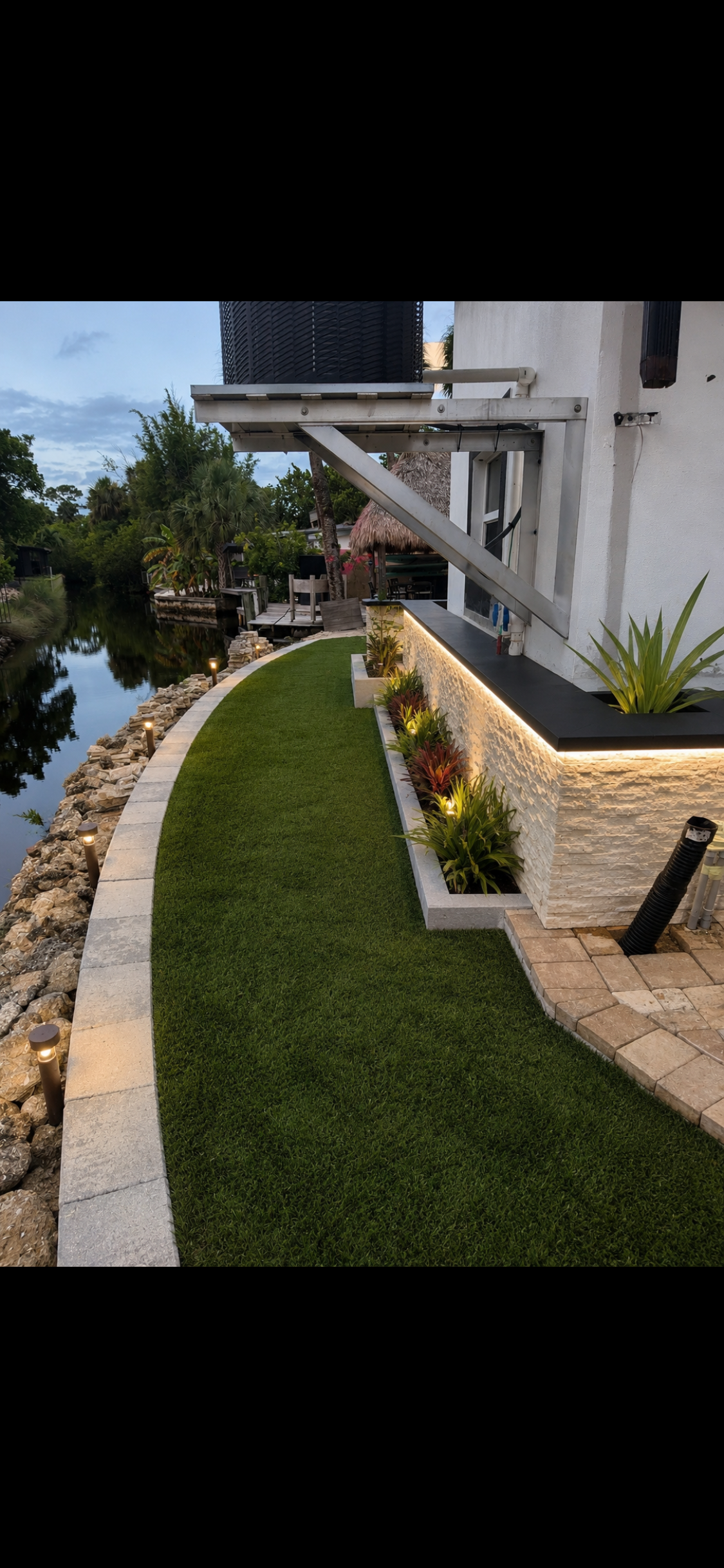 North Shore waterfront home with manicured lawn